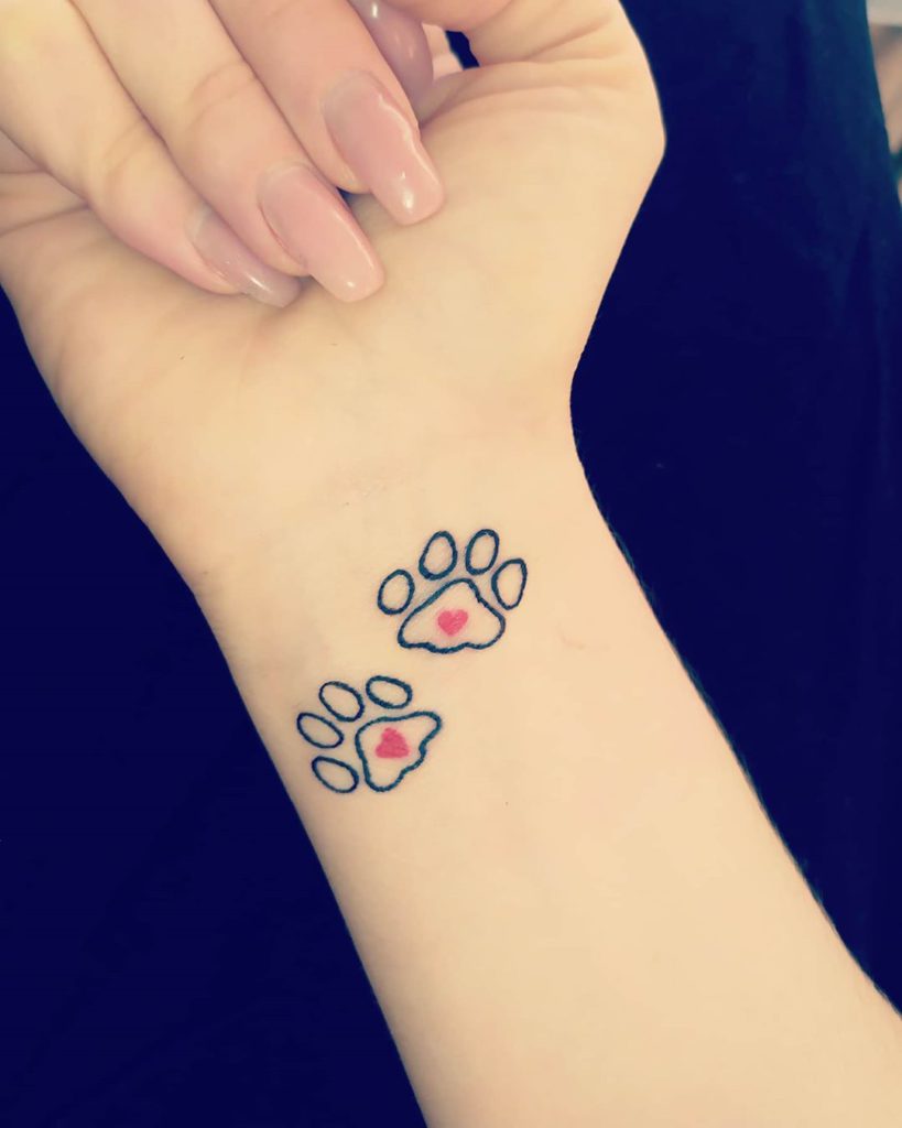 dog paws tattoo on wrist