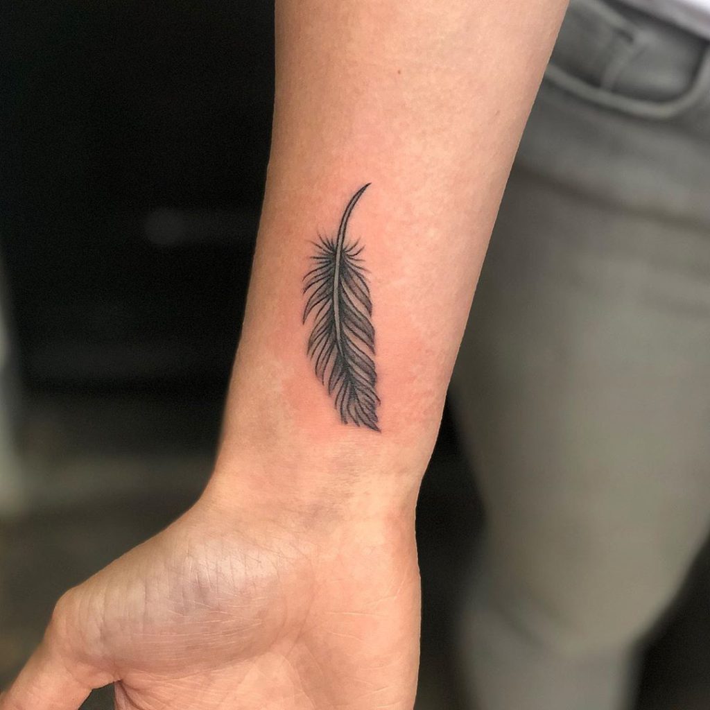feather tattoo on wrist