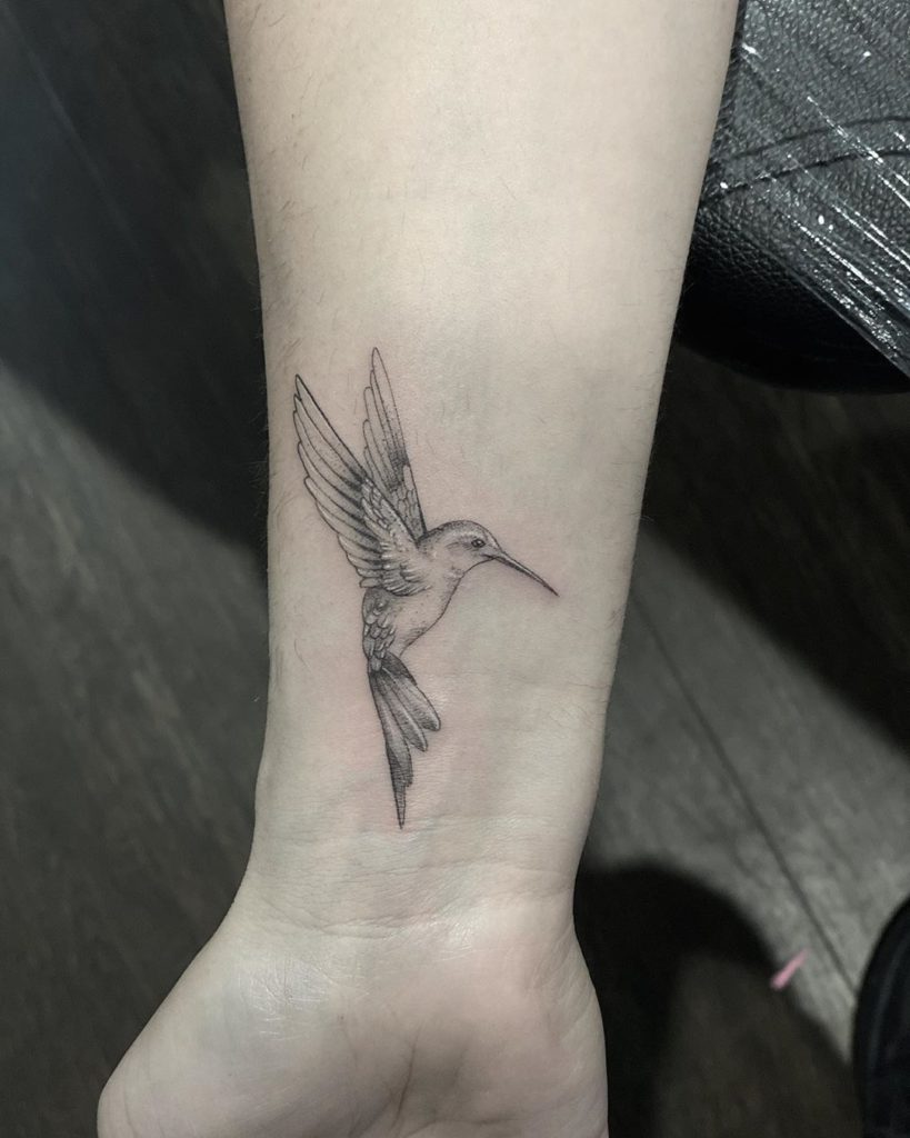 fine line Hummingbird tattoo on wrist