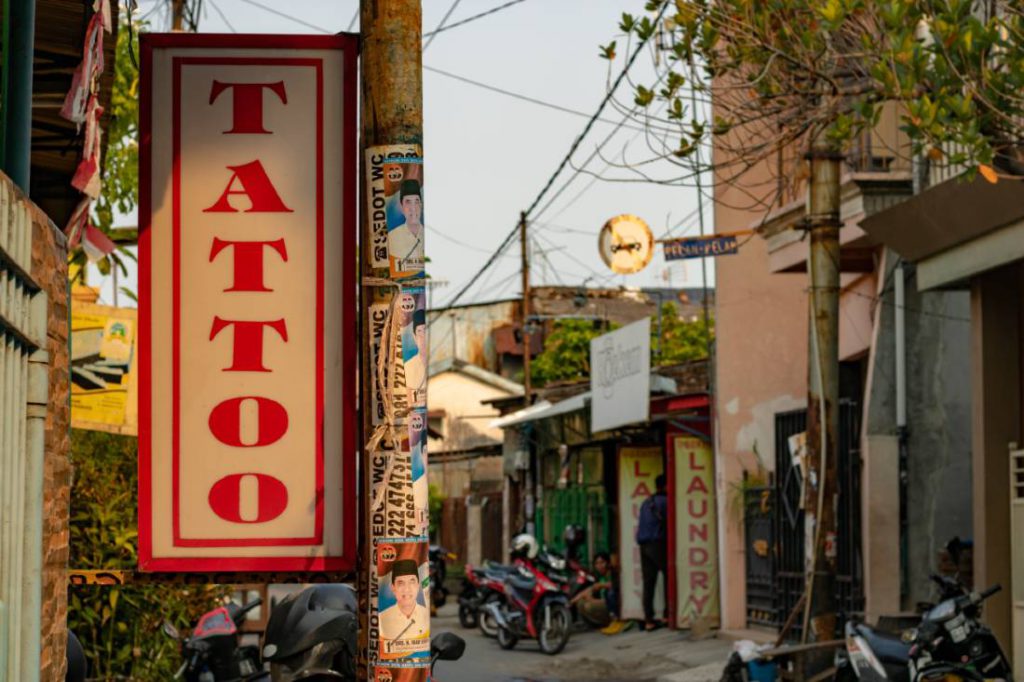 street scene with tattoo sign 