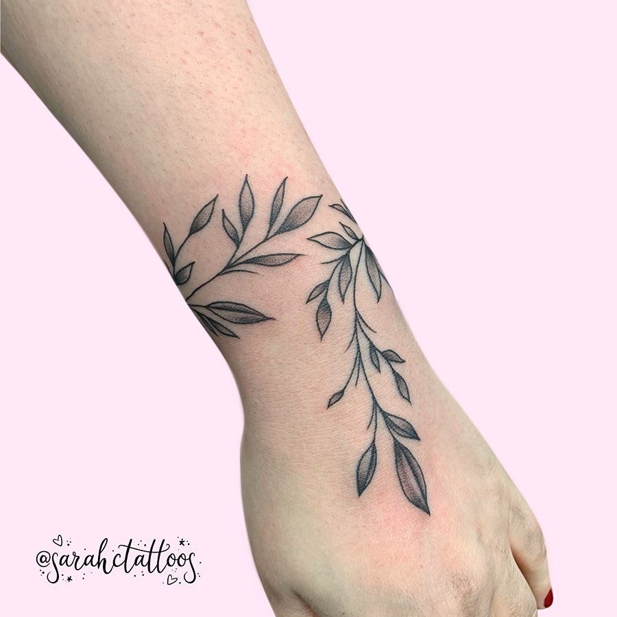 leafy wine tattoo on wrist
