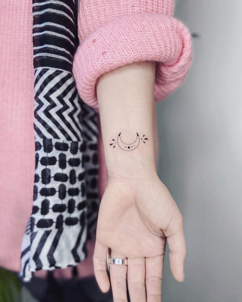 Small moon tattoo
