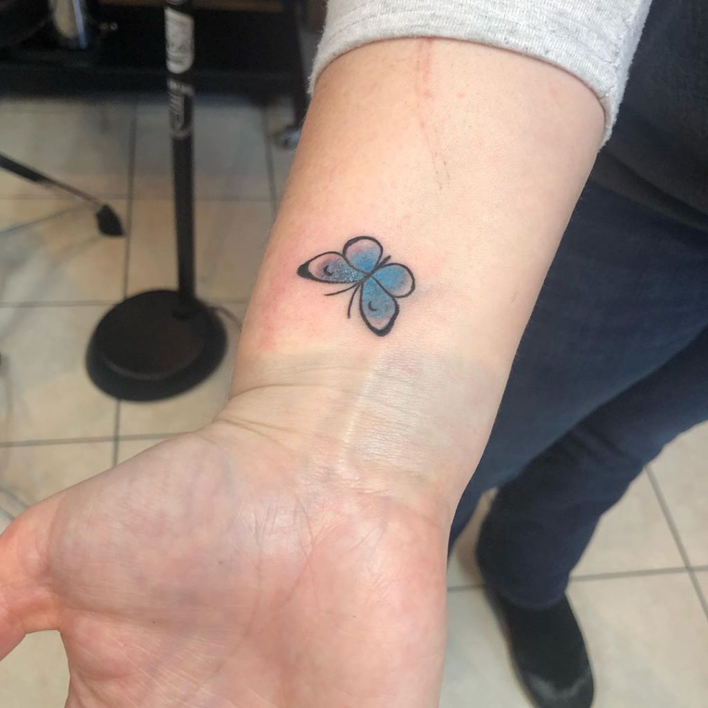 small butterfly tattoo on wrist