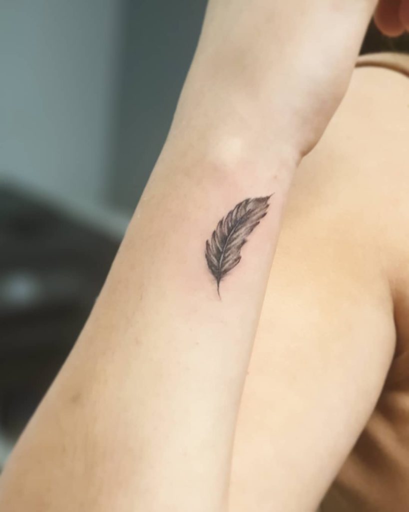 feather tattoo on wrist