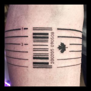 barcode tattoo on forearm