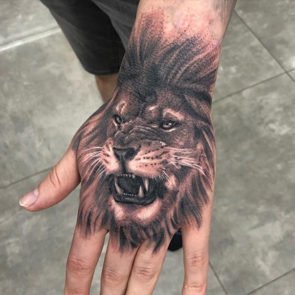 Animal Lion tattoo on Hand - Black and Grey style by Happy Truong