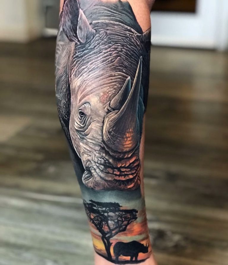 Animal Rhinoceros Rhino tattoo on Leg - Color style by Peter Hilgers