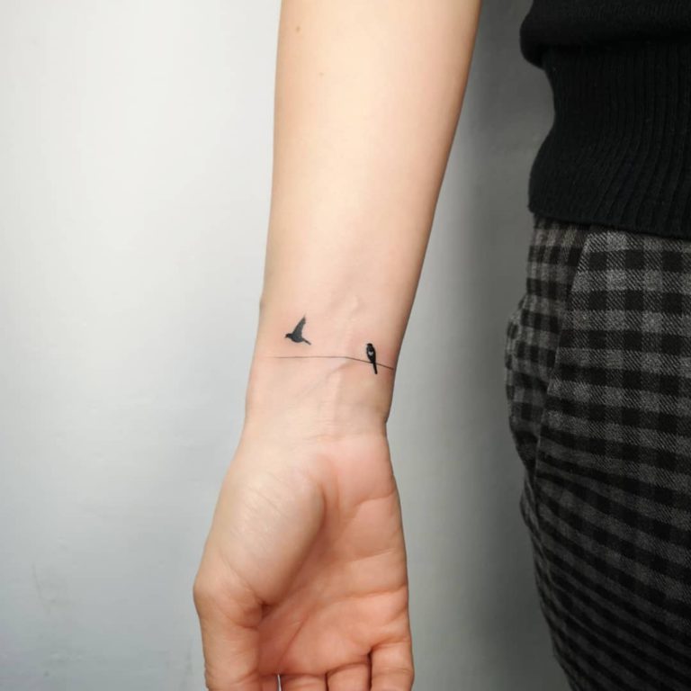 Bird tattoo on Wrist (inner) by Michał Sukiennik