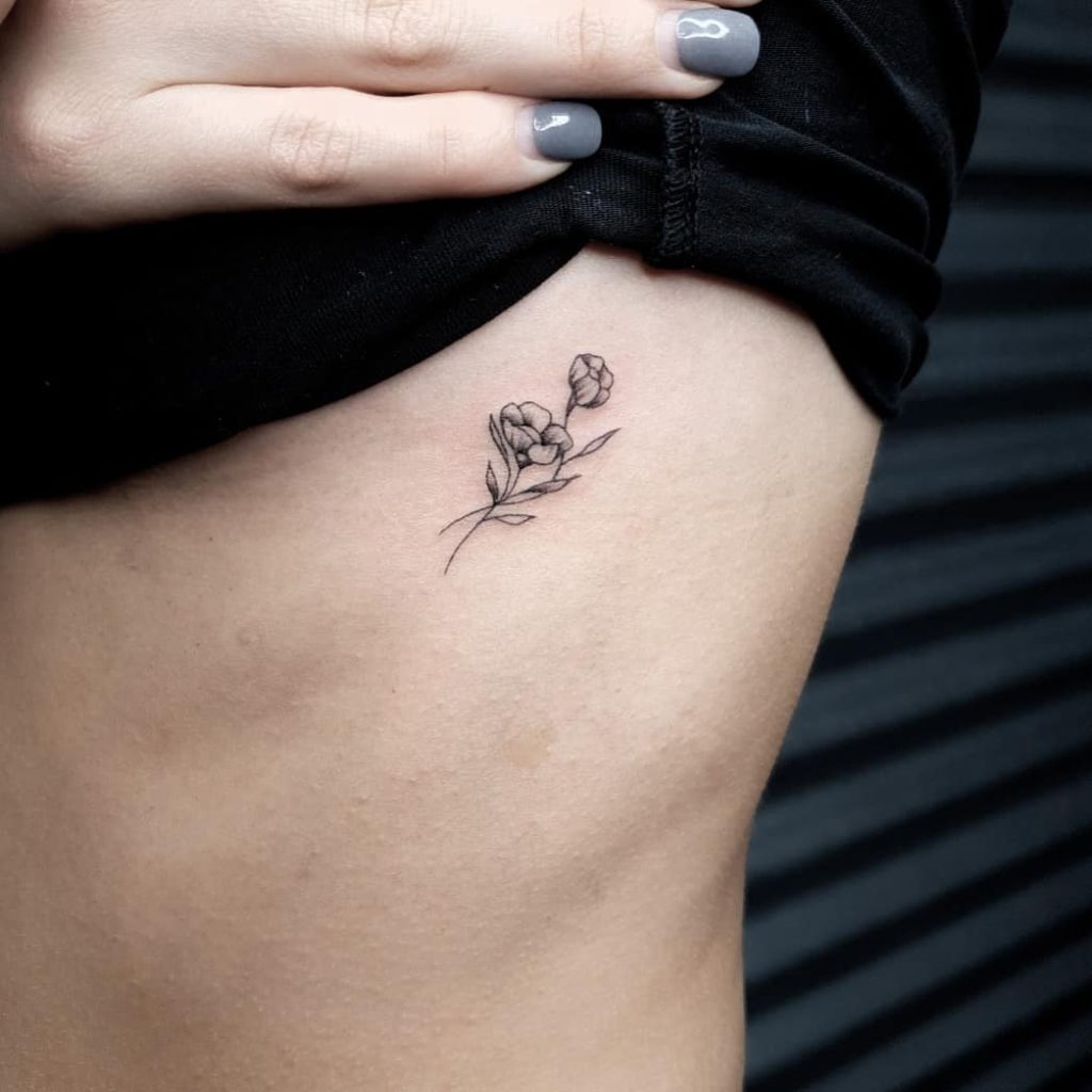 Buttercup Flower tattoo on Rib by Sarah Amelia Tattoos