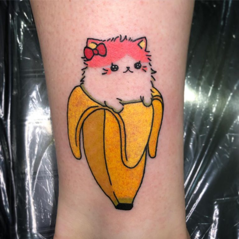 Cat in a Banana tattoo on Ankle - Color style by Faith Johnsen