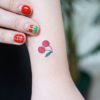 Cherry Fruit tattoo on Wrist (top) by Seyoon