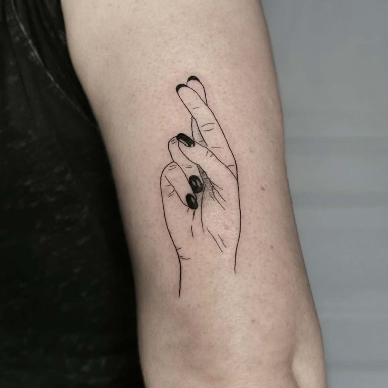Fingers Crossed tattoo on Arm (upper) by Maud Darmaun