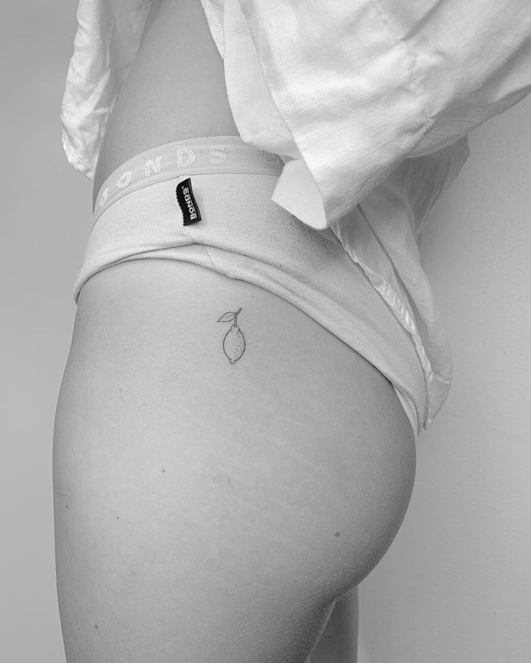 Lemon Fruit tattoo on Hip by Coco Loberg