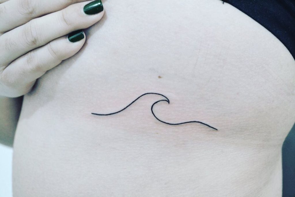 Wave tattoo on Rib by Jocelyn J.