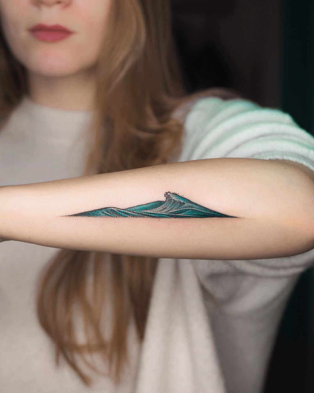Mountain and wave tattoo