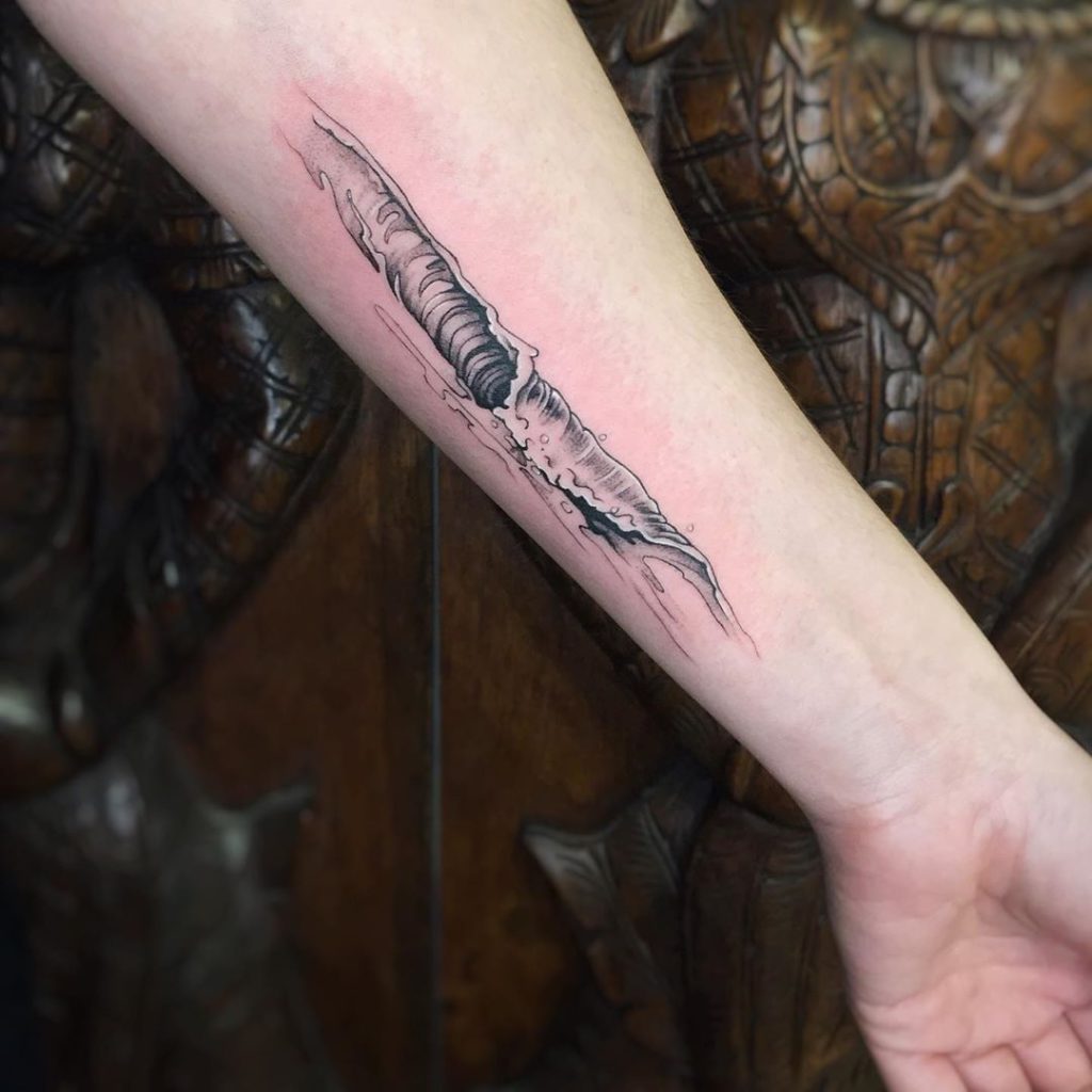 Wave tattoo on Forearm (inner) by Lynda Shipley