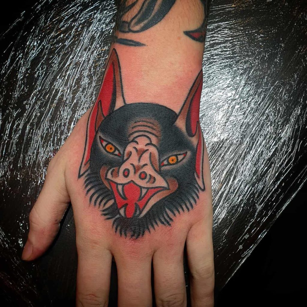 bat    tattoo on Hand - Traditional style by bold colourful tattooing