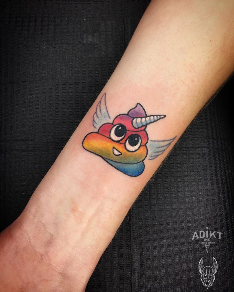 emoji poop unicorn tattoo on Wrist (inner) by Carla Heart Cruz