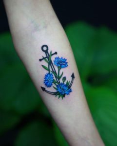 flower botanical anchor cornflower tattoo on Forearm (inner) - Color style by Ewa Czub