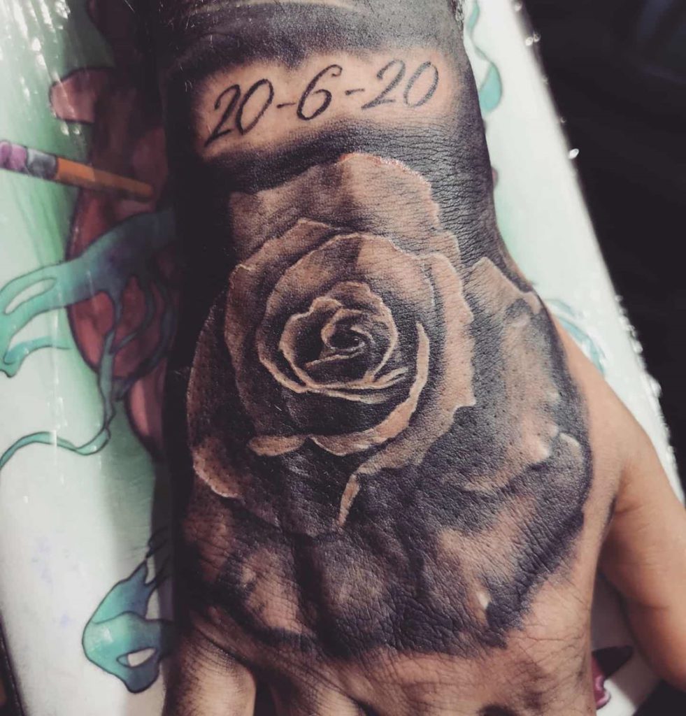 rose date memorial flower tattoo on Hand - Black and Grey style by Duncan Lambert
