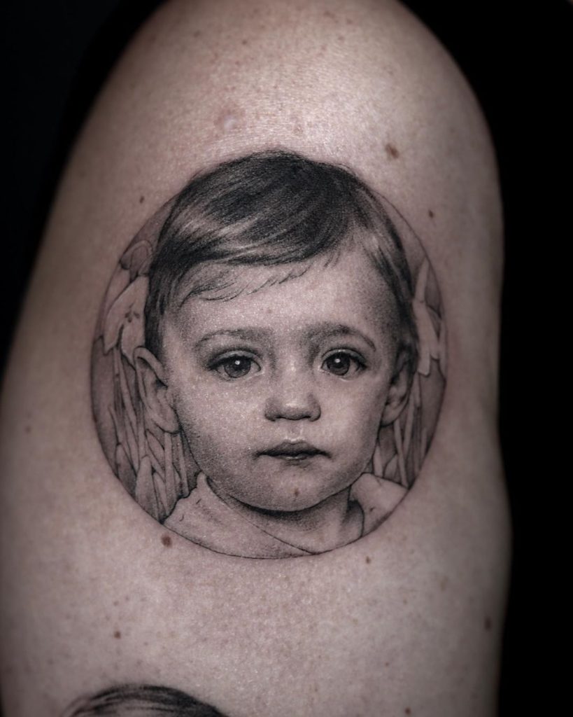 Grey Ink Child Portrait Tattoo