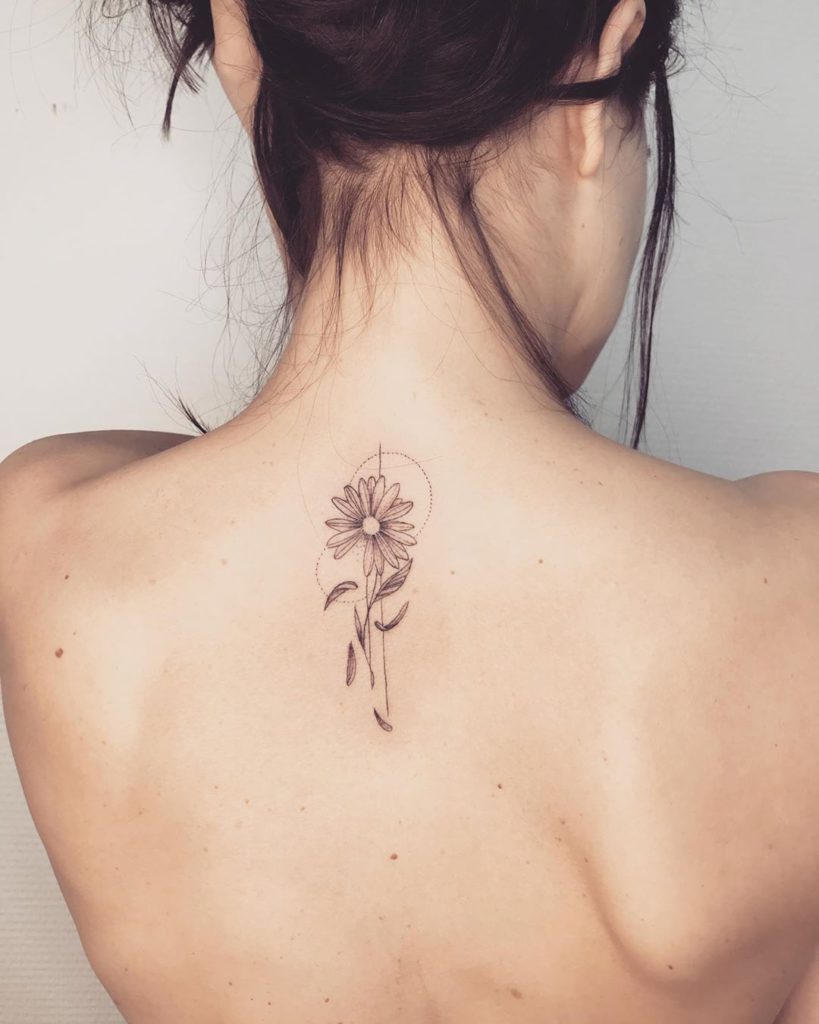 Daisy tattoo on Back (upper) by Dad'