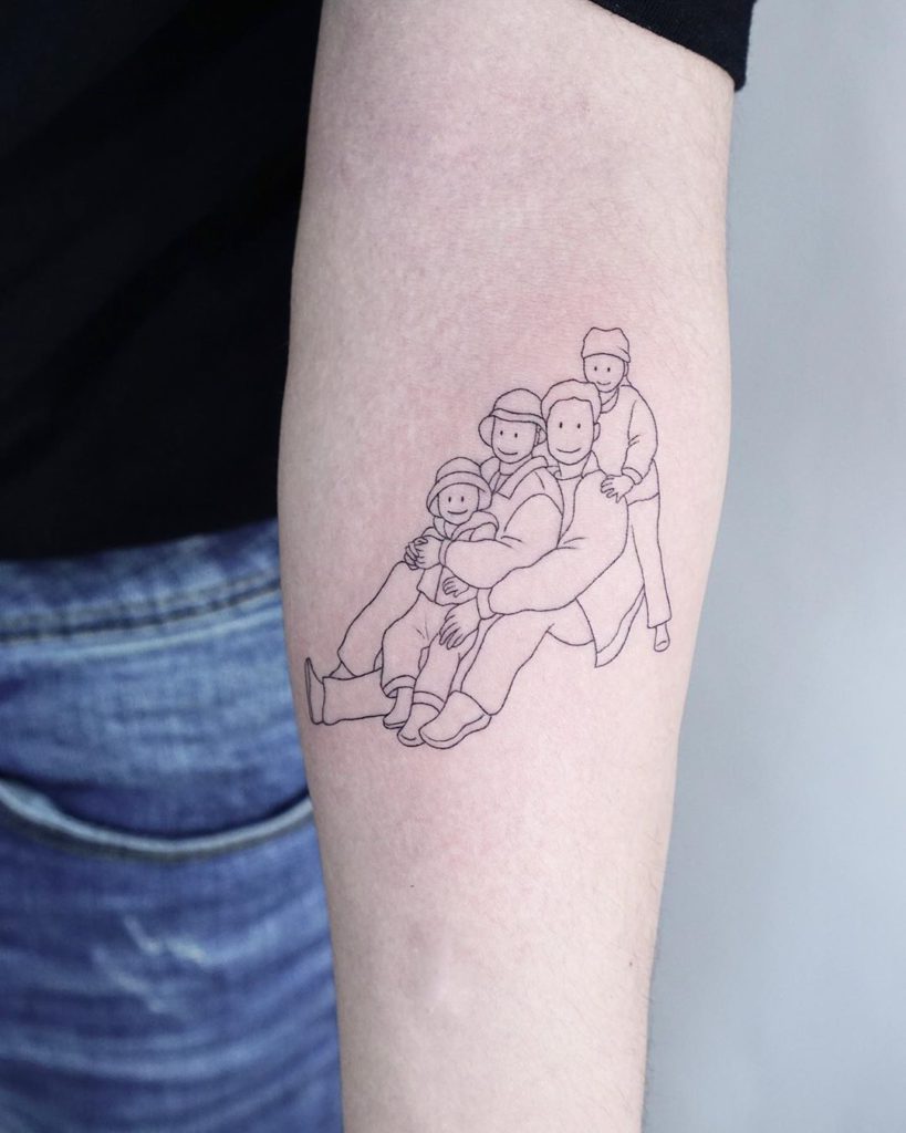 Minimalist Lady Gaga portrait tattoo on the bicep