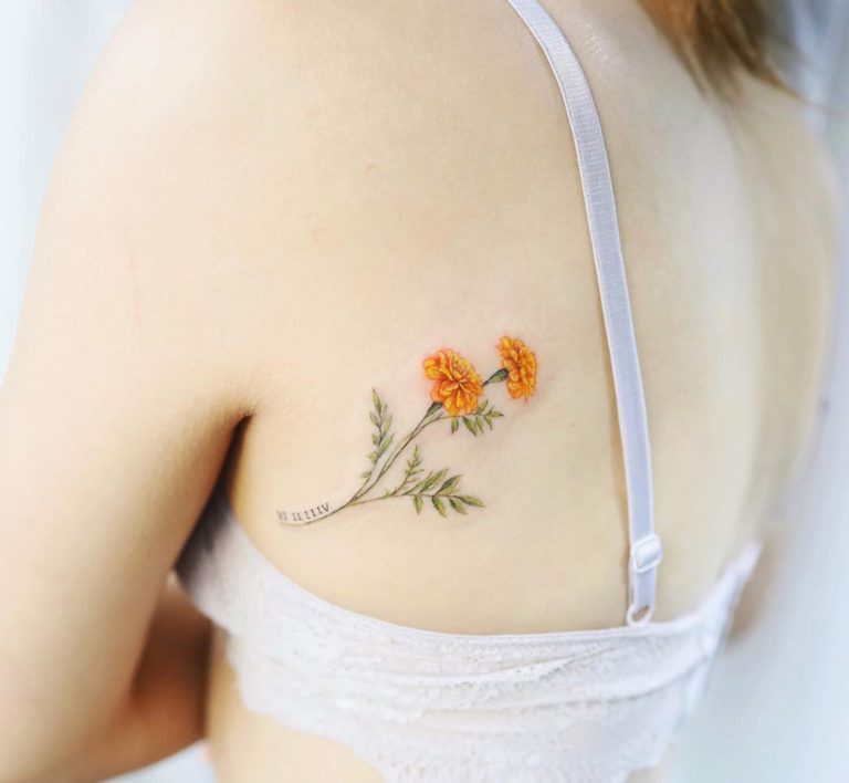 Marigold tattoo on Back by Vanessa
