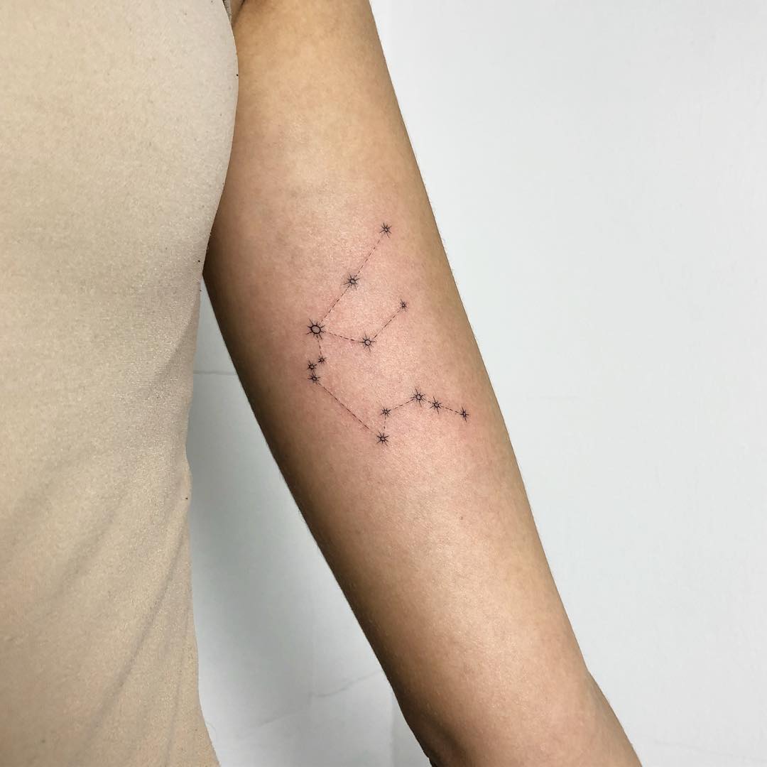 Aquarius Constellation Tattoo on Arm by Dominika Jendrasik