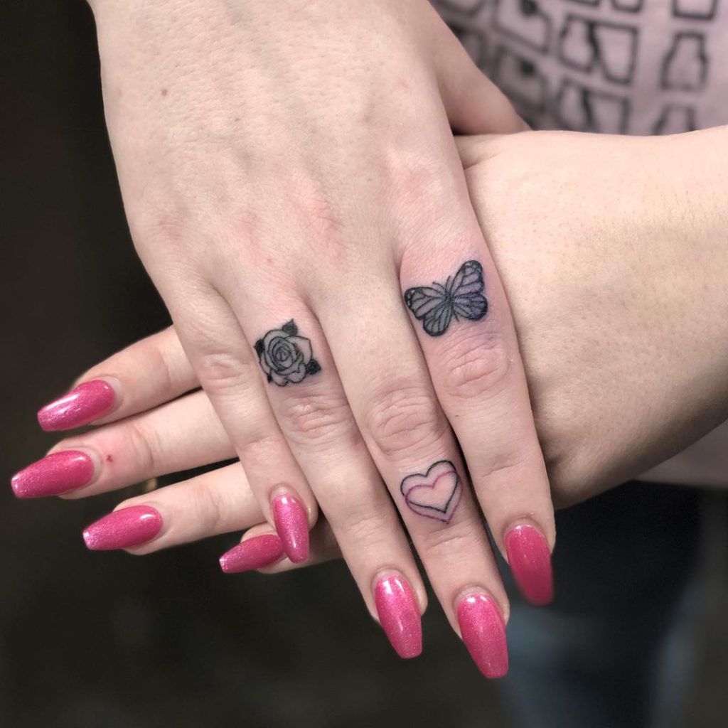 Flower tattoo on Finger by Kelcie Waslenko