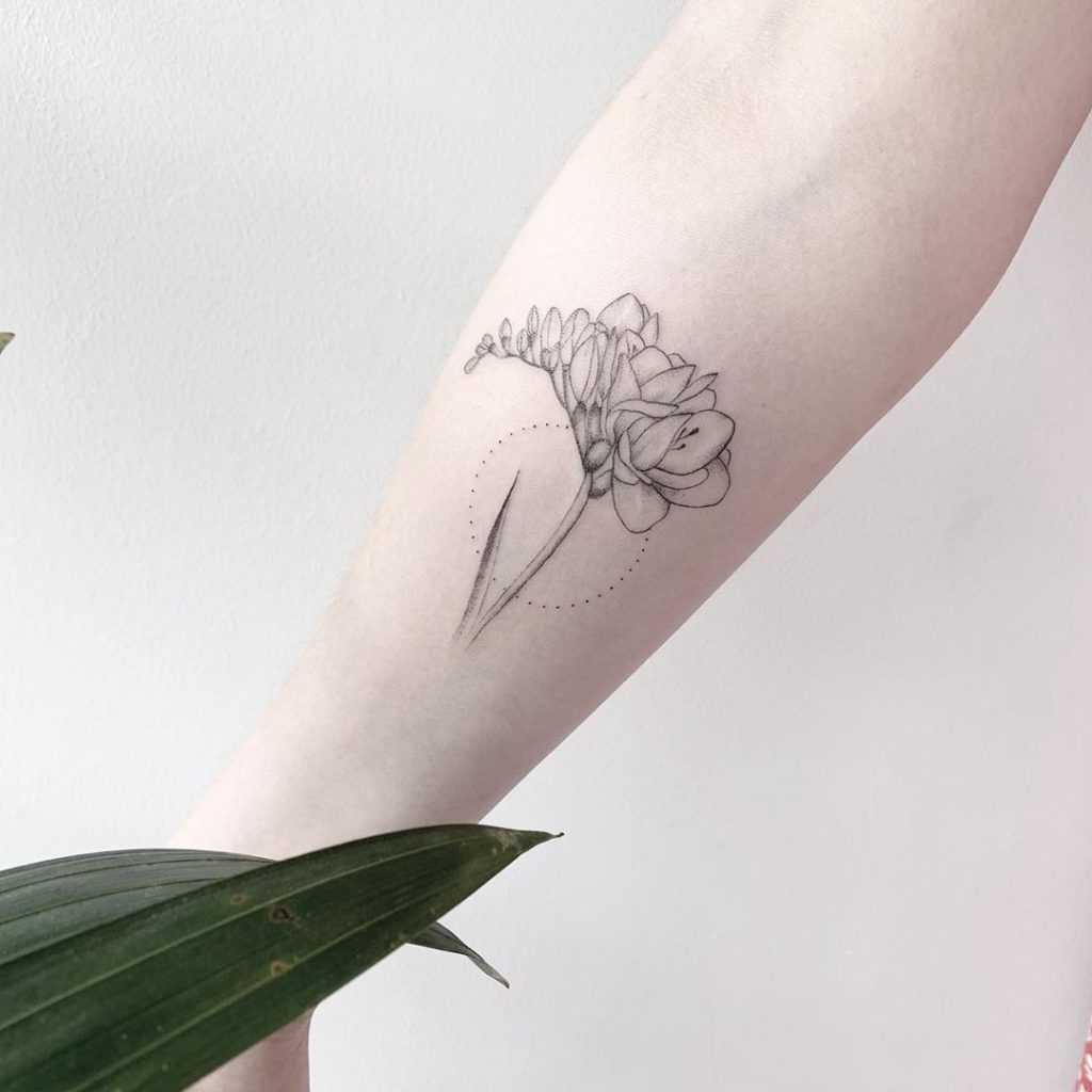 Freesia Flower Tattoo on Forearm by Vivien Szincsak