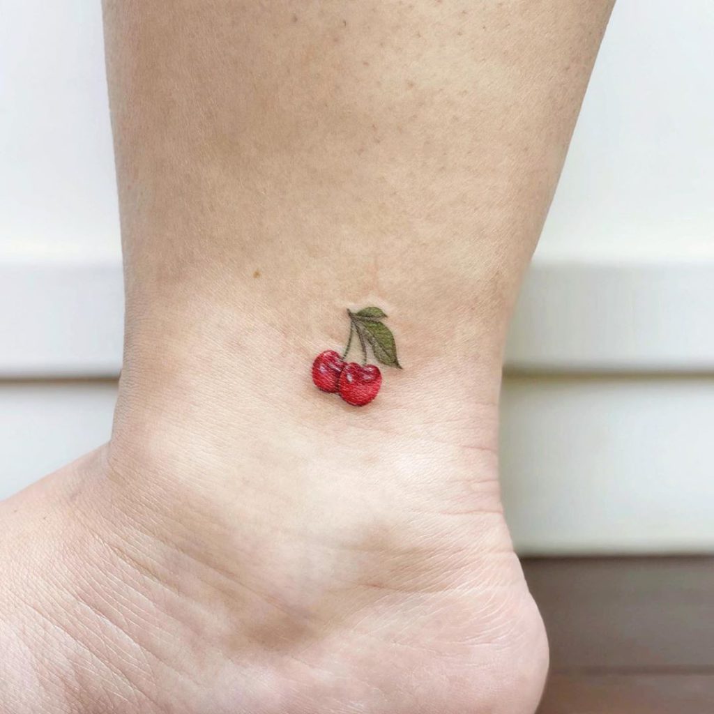 Fruit tattoo on Ankle by tangerine