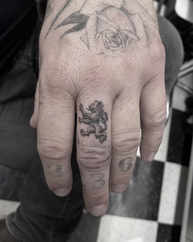 Lion Tattoo on Finger by Kissy Boy Jake