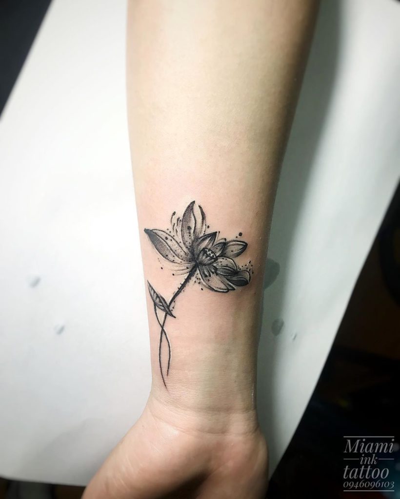 Lotus tattoo on Wrist (inner) by Thành Te Te