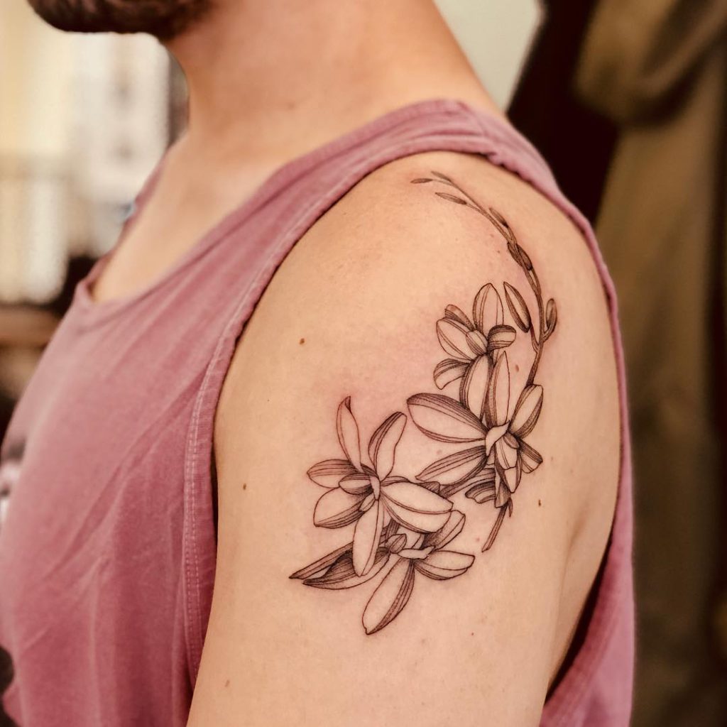 Orchid tattoo on Arm (upper) by Lianna