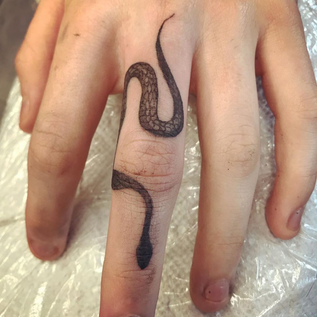Snake Tattoo on Finger by Joshua Norman