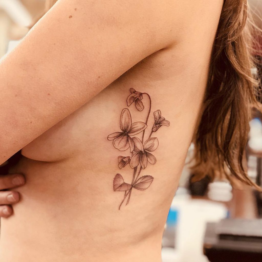 Violet tattoo on Rib by Lianna