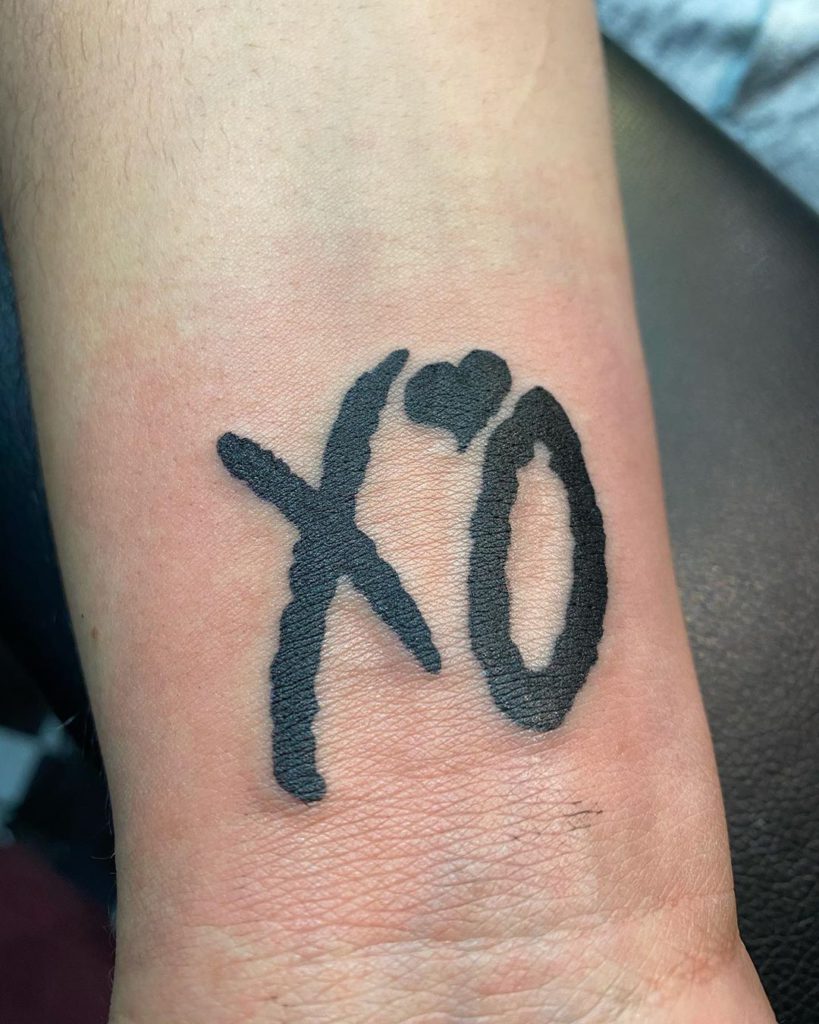 XO tattoo on Wrist (inner) - Lettering style by Shane