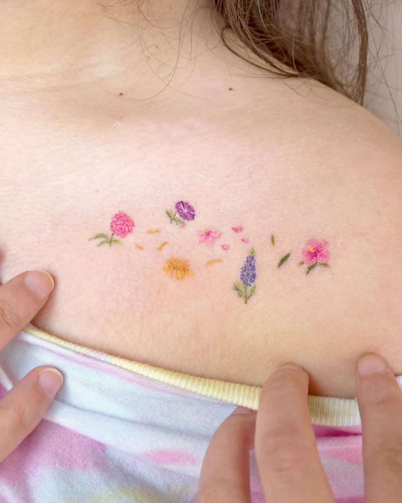 Flower tattoo on Collarbone by Sol